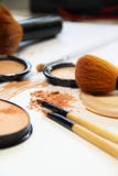 Broken Powder, Foundation And Brushes Royalty Free Stock Images Broken Powder, Foundation And Brushes Royalty Free Stock Images