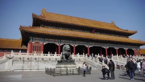 Bronze lion in front of Forbidden City,China's royal ancient architecture.