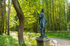 Bronze Sculpture Of Flora -the Goddess Of Spring And Flowers. Old Silvia Park In Pavlovsk, St Petersburg, Russia Stock Photos Bronze Sculpture Of Flora -the Goddess Of Spring And Flowers. Old Silvia Park In Pavlovsk, St Petersburg, Russia Stock Photos