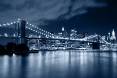 Brooklyn Bridge in New York with lights reflections on water Stock Photography Brooklyn Bridge in New York with lights reflections on water Stock Photography