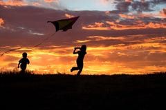 Brother And Sister Flying A Kite. Stock Photography