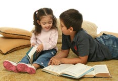 Brother and sister reading books on the floor royalty free stock images Brother and sister reading books on the floor royalty free stock images