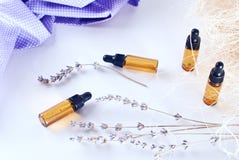 Brown bottles of essential oil with dry lavender royalty free stock photos Brown bottles of essential oil with dry lavender royalty free stock photos