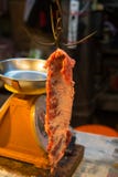 Brown iron hook in market . hanging of object cuisine . sharp tools for red rare beef meat with yellow scales . stock image Brown iron hook in market . hanging of object cuisine . sharp tools for red rare beef meat with yellow scales . stock image