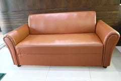 The brown sofa is made of vintage leather royalty free stock image The brown sofa is made of vintage leather royalty free stock image