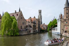 Bruges, Belgium - May 11, 2015: Tourist Visit Rozenhoedkaai In Bruges, Belgium. Stock Photo Bruges, Belgium - May 11, 2015: Tourist Visit Rozenhoedkaai In Bruges, Belgium. Stock Photo