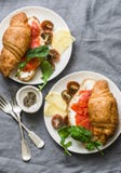 Brunch or breakfast table - croissants with cream cheese and smoked salmon, and cherry tomatoes. Delicious balanced breakfast, br stock photography Brunch or breakfast table - croissants with cream cheese and smoked salmon, and cherry tomatoes. Delicious balanced breakfast, br stock photography
