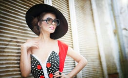 Brunette with black hat, red scarf and sunglasses posing outdoor. Attractive brunette girl with black hat, red scarf and sunglasses posing outdoor. Beautiful Stock Photography Brunette with black hat, red scarf and sunglasses posing outdoor. Attractive brunette girl with black hat, red scarf and sunglasses posing outdoor. Beautiful Stock Photography