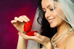 Brunette Bride Looking At The Wedding Ring Stock Photos