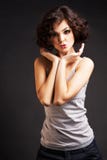 Brunette girl posing on dark background royalty free stock photo Brunette girl posing on dark background royalty free stock photo