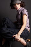 Brunette girl posing on dark background stock photo Brunette girl posing on dark background stock photo
