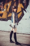 Brunette girl in short denim shorts with a bat royalty free stock images Brunette girl in short denim shorts with a bat royalty free stock images