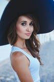 brunette in hat with large fields stock images brunette in hat with large fields stock images