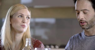 Brunette man and blonde woman talking detail. Four happy real candid friends enjoy having lunch or dinner together at stock video Brunette man and blonde woman talking detail. Four happy real candid friends enjoy having lunch or dinner together at stock video
