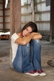Brunette Sitting in Abandoned Warehou stock images Brunette Sitting in Abandoned Warehou stock images