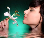 Brunette With White Lily Flowers In Water Royalty Free Stock Photos