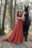 Brunette woman in a red dress with a wreath of flowers stock image Brunette woman in a red dress with a wreath of flowers stock image