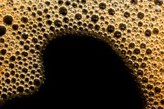 Brunt isolerat kaffeskum med bubblamakro Arkivbild Brunt isolerat kaffeskum med bubblamakro Arkivbild