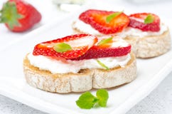 Bruschetta With Goat Cheese, Fresh Strawberries And Mint Stock Photography