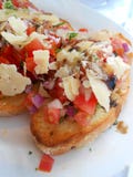 Bruschetta на белой плите стоковая фотография Bruschetta на белой плите стоковая фотография
