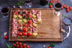 Brushetta or authentic traditional spanish tapas set for lunch table. Sharing antipasti on party or summer picnic time stock image Brushetta or authentic traditional spanish tapas set for lunch table. Sharing antipasti on party or summer picnic time stock image