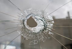 Brutet exponeringsglas med hålet arkivfoto Brutet exponeringsglas med hålet arkivfoto