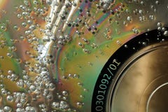 Bubbles on damaged CD surface. Macro abstract textured background