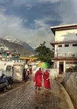 Buddhist monks walking under umbrella royalty free stock photos Buddhist monks walking under umbrella royalty free stock photos