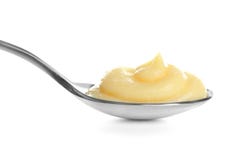 Budino di vaniglia saporito in cucchiaio fotografia stock Budino di vaniglia saporito in cucchiaio fotografia stock