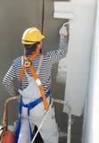 Builder facade painter at work