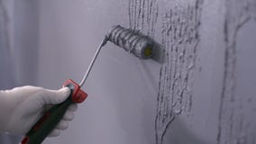 Builder puts decorative plaster on the wall stock image Builder puts decorative plaster on the wall stock image