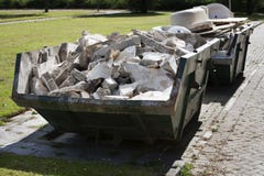 Builders skip loaded with rubble Stock Photos Builders skip loaded with rubble Stock Photos