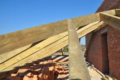 Building timber roof trusses for new attic house construction. Timber roof truss. Roofing construction. Stock Photography Building timber roof trusses for new attic house construction. Timber roof truss. Roofing construction. Stock Photography