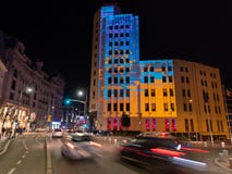 Buildings in Bucharest in the colors of the national Ukrainian flag. Victory Street - Calea Victoriei.