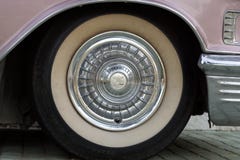 Bulgaria, Elhovo - October 07, 2017 : Pink Cadillac Series 62 Coupe 1958 Badge. wheel detail of Pink Cadillac car Royalty Free Stock Image Bulgaria, Elhovo - October 07, 2017 : Pink Cadillac Series 62 Coupe 1958 Badge. wheel detail of Pink Cadillac car Royalty Free Stock Image