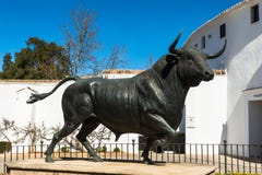 Bull statue in front of the bullfighting arena in Ronda, Spain royalty free stock image Bull statue in front of the bullfighting arena in Ronda, Spain royalty free stock image