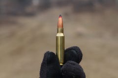 Bullets for rifle. Bullet in the box. stock photos Bullets for rifle. Bullet in the box. stock photos
