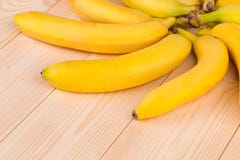 Bunch Of Bananas Fruit On A Wooden Background Stock Photos
