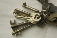 Bunch of old rusty keys of various size on a key-ring stock image Bunch of old rusty keys of various size on a key-ring stock image