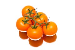 Bunch of ripe tomatoes on a white background with reflection stock photos Bunch of ripe tomatoes on a white background with reflection stock photos