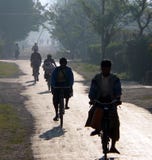 Burmese Cycling To Work & School Royalty Free Stock Images Burmese Cycling To Work & School Royalty Free Stock Images