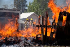 Burning Barn And Firefighters. Stock Photos