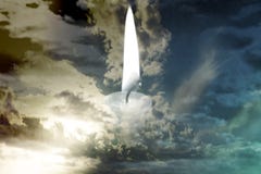 A burning candle in the middle of storm clouds royalty free stock photos A burning candle in the middle of storm clouds royalty free stock photos
