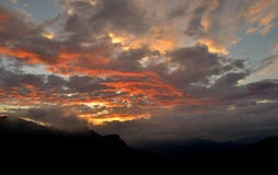 Colorful sky at sunrise in the mountains. Silhouetted hillside and a colorful sky at sunrise Stock Images Colorful sky at sunrise in the mountains. Silhouetted hillside and a colorful sky at sunrise Stock Images