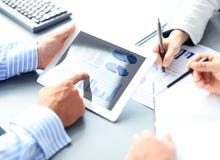 Business adviser analyzing financial figures stock photos Business adviser analyzing financial figures stock photos