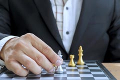 Business battles will require a strong plan. Businessmen who are playing chess royalty free stock photography Business battles will require a strong plan. Businessmen who are playing chess royalty free stock photography