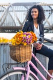 Business black woman with vintage bicycle drinking coffe royalty free stock photography Business black woman with vintage bicycle drinking coffe royalty free stock photography