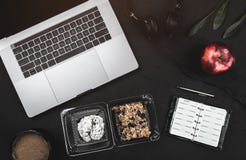 Business break with sweet biscuits and fresh apple. Laptop, headphones and note book Royalty Free Stock Photo Business break with sweet biscuits and fresh apple. Laptop, headphones and note book Royalty Free Stock Photo