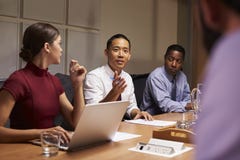 Business colleagues in discussion at a meeting, close up royalty free stock image Business colleagues in discussion at a meeting, close up royalty free stock image