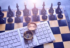 Business development strategy and direction concept with chess, compass and computer keyboard. royalty free stock images Business development strategy and direction concept with chess, compass and computer keyboard. royalty free stock images